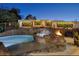 Luxury pool and spa with a waterfall feature and fire pit at 2 Yorkridge Ct, Henderson, NV 89052