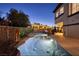 Resort-style pool with waterfall, fire pit, and lush landscaping at 2 Yorkridge Ct, Henderson, NV 89052