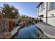 Stunning pool with a rock waterfall and lush landscaping at 2 Yorkridge Ct, Henderson, NV 89052