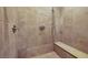 Large walk-in shower with tiled walls and built-in seat at 2 Yorkridge Ct, Henderson, NV 89052