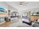 Open concept kitchen and living room with island and fireplace at 2024 Shadow Brook Way, Henderson, NV 89074