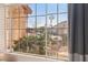 Window view of a residential neighborhood with lush landscaping at 2024 Shadow Brook Way, Henderson, NV 89074