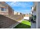 Small backyard with artificial turf and a swing at 2097 Audrey Hepburn St, Las Vegas, NV 89142
