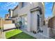 Private backyard with swing and artificial turf at 2097 Audrey Hepburn St, Las Vegas, NV 89142