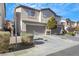 Two-story townhome with attached garage and landscaping at 2097 Audrey Hepburn St, Las Vegas, NV 89142