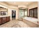 Spa-like bathroom with a large soaking tub, walk-in shower, and double vanity at 2204 Glenbrook Way, Las Vegas, NV 89117