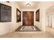 Elegant entryway with double wood doors and ornate floor tile at 2204 Glenbrook Way, Las Vegas, NV 89117