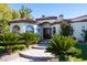 Grand entrance with double doors and lush landscaping at 2204 Glenbrook Way, Las Vegas, NV 89117
