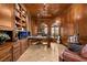Home office with built-in shelving, wood paneling, and large windows at 2204 Glenbrook Way, Las Vegas, NV 89117