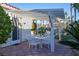 Relaxing patio with pergola, seating area, and lush landscaping at 2204 Glenbrook Way, Las Vegas, NV 89117