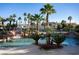 Community pool with waterfall feature and lush landscaping at 2204 Glenbrook Way, Las Vegas, NV 89117