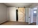 Bedroom featuring a stylish barn door and an open doorway to another room at 3025 Sunrise Bay Ave, North Las Vegas, NV 89031