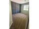 This bedroom has a neutral color scheme, with a large window that provides natural light at 3025 Sunrise Bay Ave, North Las Vegas, NV 89031