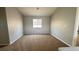 Spacious bedroom with neutral walls, plush carpet, and a bright window creating a cozy retreat at 3025 Sunrise Bay Ave, North Las Vegas, NV 89031