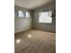 Bedroom with three windows and neutral colored walls with carpeted floor at 3025 Sunrise Bay Ave, North Las Vegas, NV 89031