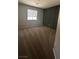 Bedroom featuring carpet, accent wall, and a window with blinds at 3025 Sunrise Bay Ave, North Las Vegas, NV 89031