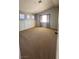 Spacious carpeted bedroom boasts large windows and custom wall panels at 3025 Sunrise Bay Ave, North Las Vegas, NV 89031