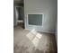 Neutral bedroom features carpeted floors and a window to provide natural light at 3025 Sunrise Bay Ave, North Las Vegas, NV 89031