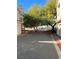 A view of multiple townhomes with two car garages on a sunny day at 3025 Sunrise Bay Ave, North Las Vegas, NV 89031