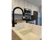 Focus on the kitchen sink and faucet showcasing the modern design and practical features at 3025 Sunrise Bay Ave, North Las Vegas, NV 89031