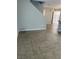 Living room area with ceramic tile, open floor plan, and staircase, perfect for modern living at 3025 Sunrise Bay Ave, North Las Vegas, NV 89031
