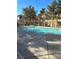 Community pool featuring a clear water, secure fencing, and concrete surround, perfect for relaxing and recreation at 3025 Sunrise Bay Ave, North Las Vegas, NV 89031