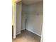 A walk-in closet features tile flooring and built-in shelving for organized storage at 3025 Sunrise Bay Ave, North Las Vegas, NV 89031