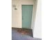 Light teal colored front door with a welcome mat at 3550 Bay Sands Dr # 2048, Laughlin, NV 89029