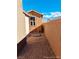 Side yard with gravel and block wall at 3660 Timberlake Dr, Las Vegas, NV 89115