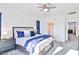 Main bedroom with plush bed, ceiling fan, and plenty of natural light at 4025 Redwood Glen Ct, Las Vegas, NV 89141