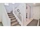 Modern staircase with white railings and gray carpet at 4025 Redwood Glen Ct, Las Vegas, NV 89141