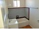 Clean bathroom with bathtub, single sink vanity, and tile surround at 412 S Maryland Pkwy, Las Vegas, NV 89101