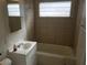 Clean bathroom with tiled walls and a bathtub at 412 S Maryland Pkwy, Las Vegas, NV 89101