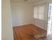 Simple living room with hardwood floors and window coverings at 412 S Maryland Pkwy, Las Vegas, NV 89101