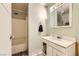 Small bathroom featuring a vanity with storage and a shower and tub combo at 4214 Bay Cir, Las Vegas, NV 89122