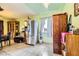 An open dining area featuring a stainless steel refrigerator and stylish storage cabinet at 4214 Bay Cir, Las Vegas, NV 89122