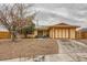 Charming single-story home with a gravel yard and an attached two-car garage at 4214 Bay Cir, Las Vegas, NV 89122