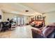 Spacious living room with tile flooring, comfortable seating, and access to the patio at 4214 Bay Cir, Las Vegas, NV 89122