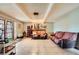 A spacious living room features tile flooring, comfortable sofas, and bright lighting at 4214 Bay Cir, Las Vegas, NV 89122