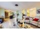 Expansive living area with tile floors, seamlessly connecting living, dining, and kitchen spaces at 4214 Bay Cir, Las Vegas, NV 89122