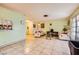 Open-concept living room featuring tile flooring, abundant natural light, and comfortable seating at 4214 Bay Cir, Las Vegas, NV 89122