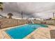 Outdoor pool with lounge chairs and mature palm trees at 4214 Bay Cir, Las Vegas, NV 89122
