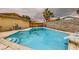 A refreshing in-ground pool with a diving board, steps, and surrounding patio space at 4214 Bay Cir, Las Vegas, NV 89122