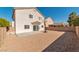 Spacious backyard with a basketball hoop and a patio, perfect for outdoor activities at 4929 Morning Falls Ave, Las Vegas, NV 89131