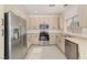 Modern kitchen with stainless steel appliances, ample counter space, and stylish cabinetry at 4929 Morning Falls Ave, Las Vegas, NV 89131