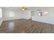 Upstairs living room featuring wood-look floors, ceiling fan and lots of natural light at 4929 Morning Falls Ave, Las Vegas, NV 89131
