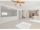 Bright, open-concept living space with recessed lighting, tile floors and neutral color palette at 4929 Morning Falls Ave, Las Vegas, NV 89131