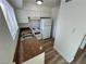 Galley kitchen with white cabinetry and granite countertops at 501 S Maryland Pkwy # B2, Las Vegas, NV 89101