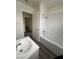 Updated bathroom with a tub, sink and new flooring at 521 S Maryland Pkwy # A10, Las Vegas, NV 89101