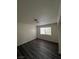 Bright bedroom with wood-look floors and large window at 521 S Maryland Pkwy # A10, Las Vegas, NV 89101